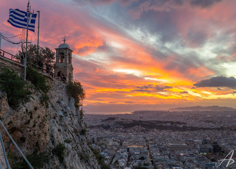 A sunset over the city of Athens, taken from Mount Lycabettus.