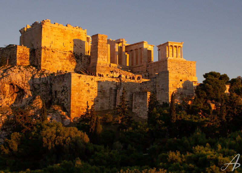 A golden hour view of the Acropolis in Athens.