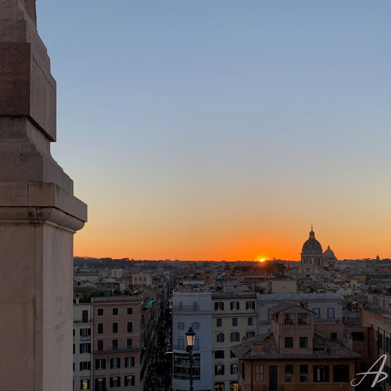 A sunset over the rooftops of Rome, taken from the Spanish Steps in Rome, Italy.