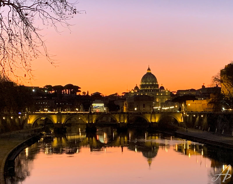 The after sunset glow reflecting off of the Tiber River in Rome Italy.